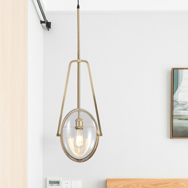 Modern Brass Pendant Light with Clear Glass Shade and Unique Halberd Frame
