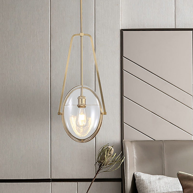 Modern Brass Pendant Light with Clear Glass Shade and Unique Halberd Frame