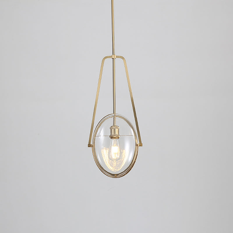 Modern Brass Pendant Light with Clear Glass Shade and Unique Halberd Frame