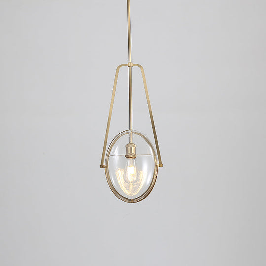 Modern Brass Pendant Light with Clear Glass Shade and Unique Halberd Frame