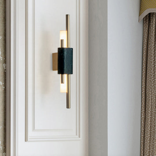 Modern Brass LED Wall Sconce with Slim Tube Design and Black Marble Deco