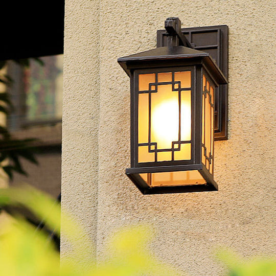Metallic Outdoor Wall Sconce with Yellow Glass Shade: Cuboid Country-Style 1-Bulb Lamp in Black