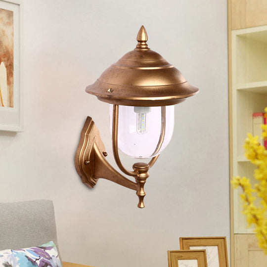 Lodges Urn 1-Light Sconce: Sleek Black/Brass Wall Lighting with Clear Glass Shade