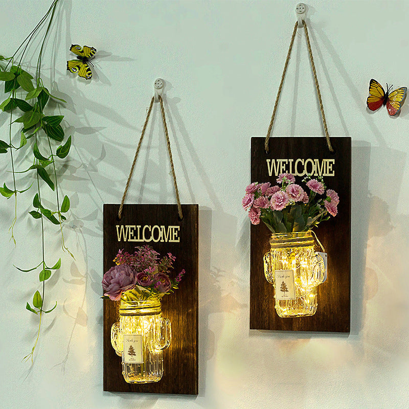 Rustic Style Clear Glass Shade Wall Sconce with Purple Flower Wall String Lights for Cafe