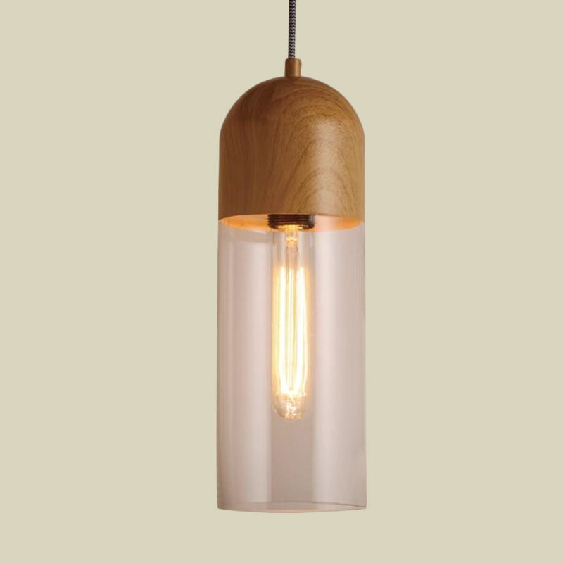 Modern Clear Glass Pendant Light: Sleek Half-Capsule Design, Wood Fixture for Bedroom