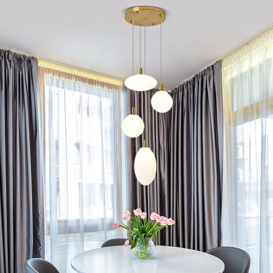 Minimalistic Gold/Black Pendant Lamp with 4 Lights and Cream Glass"
or 
"Minimalist 4-Light Gold/Black Pendant Lamp with Cream Glass