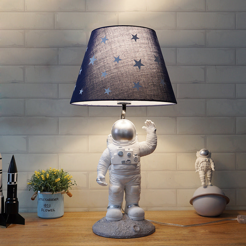 Blue Empire Shade Night Lamp - Kids Star Patterned Fabric Table Lighting with Carved Spaceman Base, 10"/13" Wide