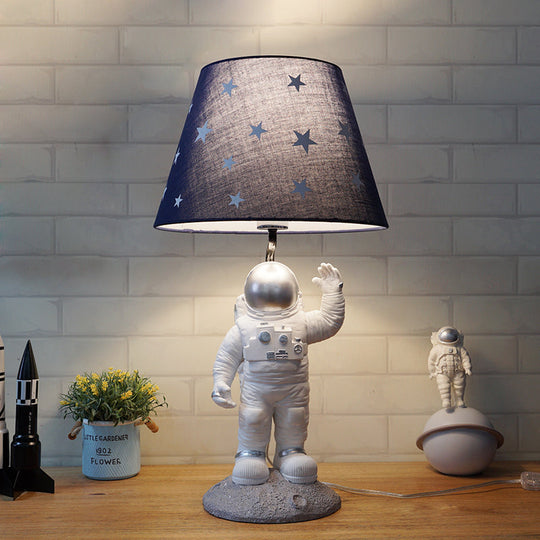 Blue Empire Shade Night Lamp - Kids Star Patterned Fabric Table Lighting with Carved Spaceman Base, 10"/13" Wide