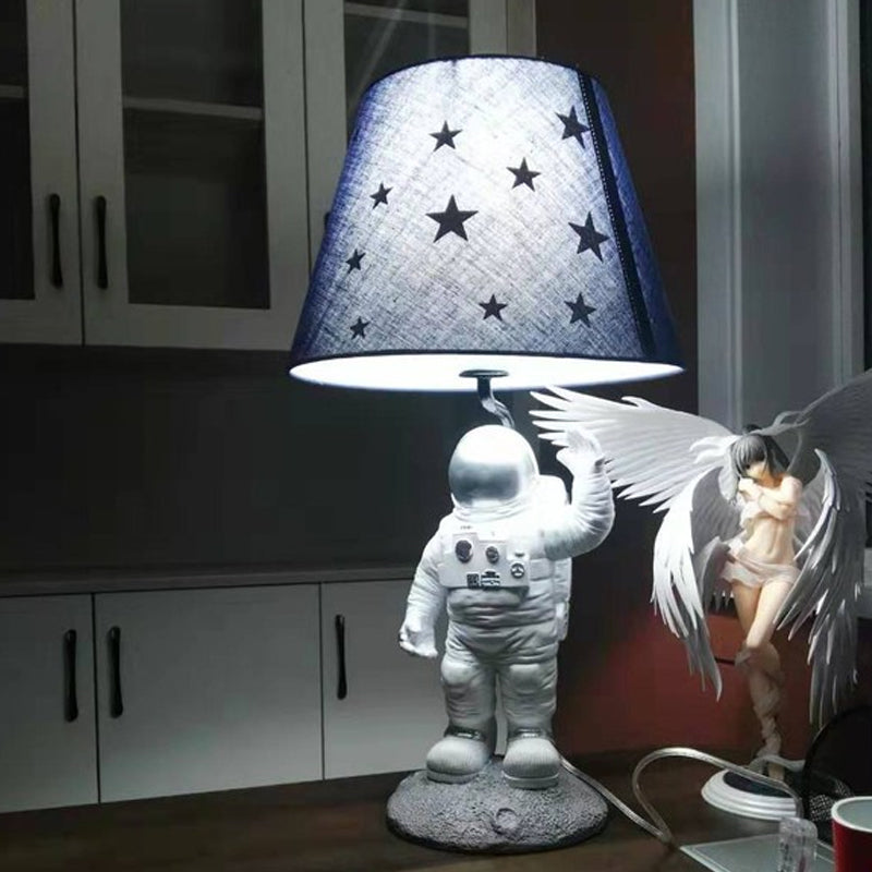 Blue Empire Shade Night Lamp - Kids Star Patterned Fabric Table Lighting with Carved Spaceman Base, 10"/13" Wide
