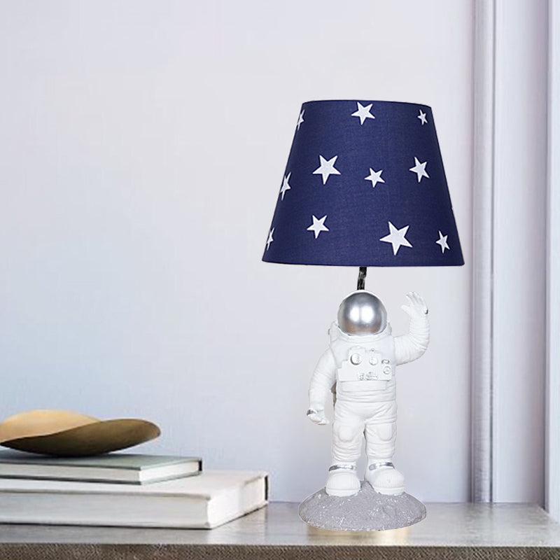 Blue Empire Shade Night Lamp - Kids Star Patterned Fabric Table Lighting with Carved Spaceman Base, 10"/13" Wide