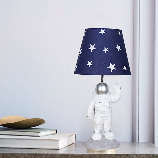 Blue Empire Shade Night Lamp - Kids Star Patterned Fabric Table Lighting with Carved Spaceman Base, 10"/13" Wide