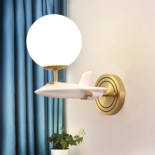 Gold Spaceship Wall Sconce with Cream Glass Globe for Kids Room - 1/2 Bulb Fixture in White & Gold