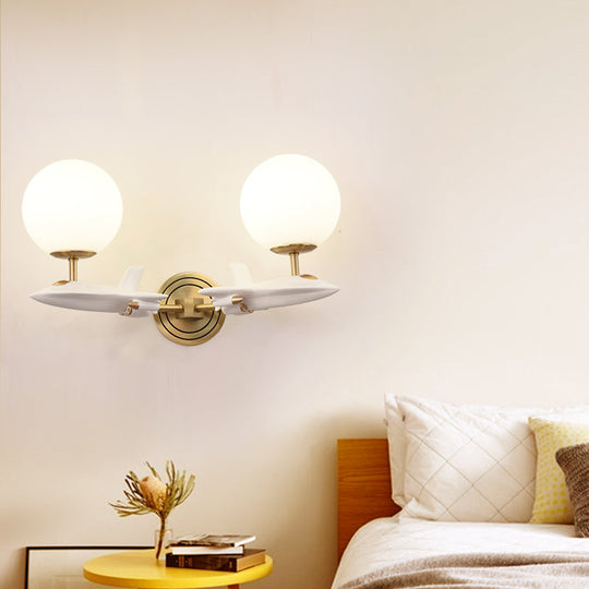 Gold Spaceship Wall Sconce with Cream Glass Globe for Kids Room - 1/2 Bulb Fixture in White & Gold