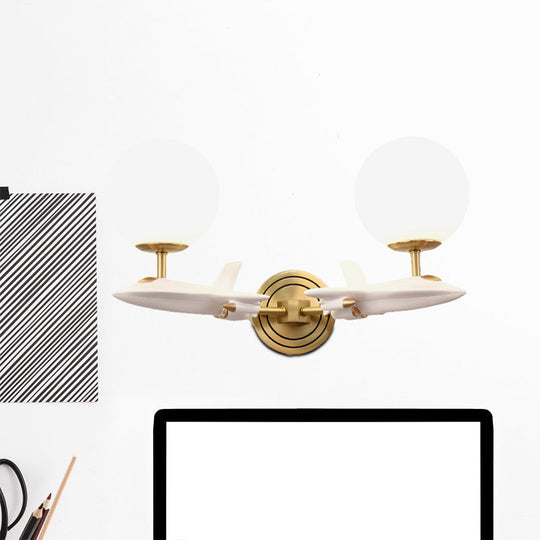 Gold Spaceship Wall Sconce with Cream Glass Globe for Kids Room - 1/2 Bulb Fixture in White & Gold