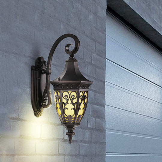 Classic 1-Light Outdoor Wall Hanging Light in Black with Metal Curving Design and Urn Yellow Glass Shade