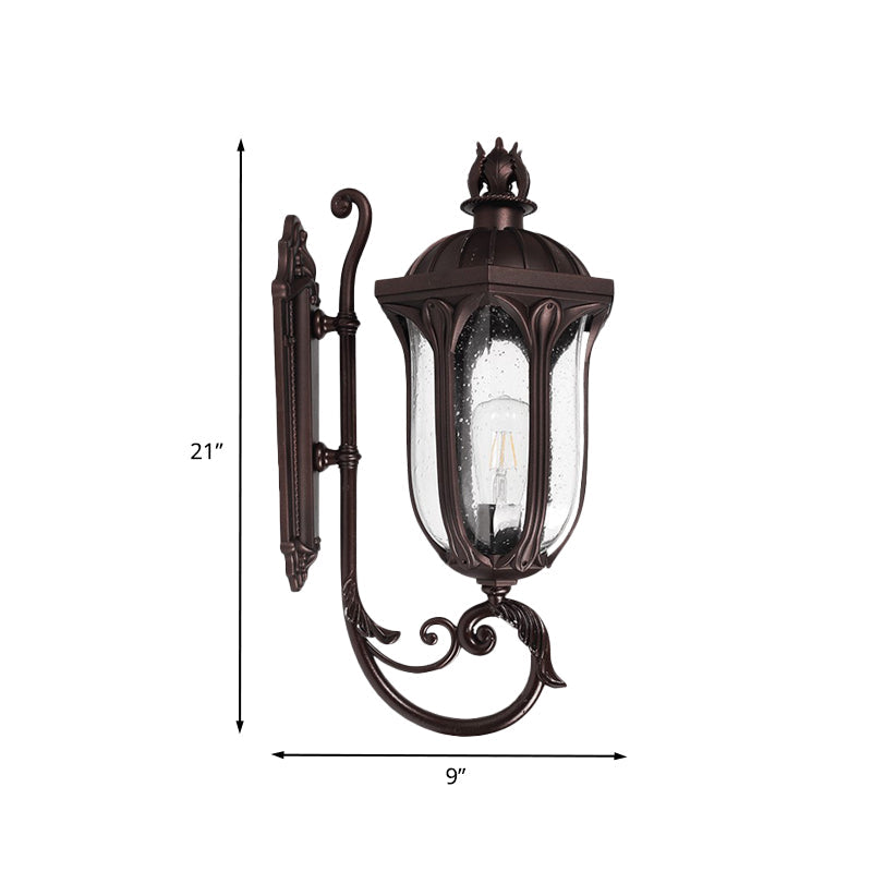Lodge 1-Head Courtyard Wall Light Fixture with Seedy Glass and Swooping Arm in Dark Coffee