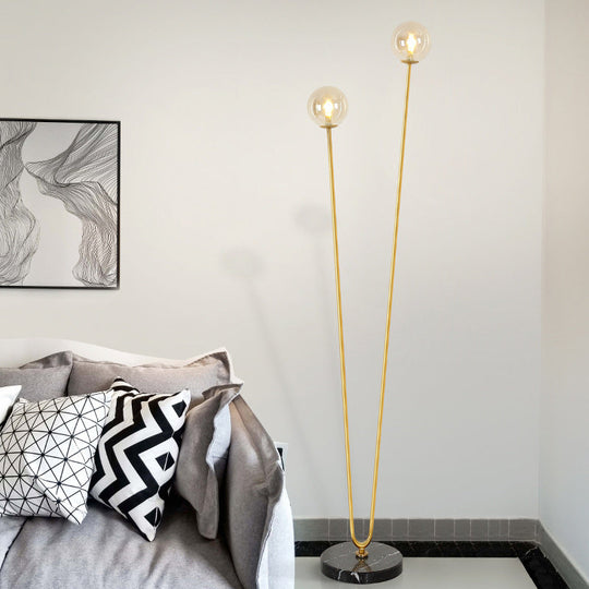 Modernist Metallic Gold LED Floor Reading Lamp with U-Shaped Design and Globe Glass Shade